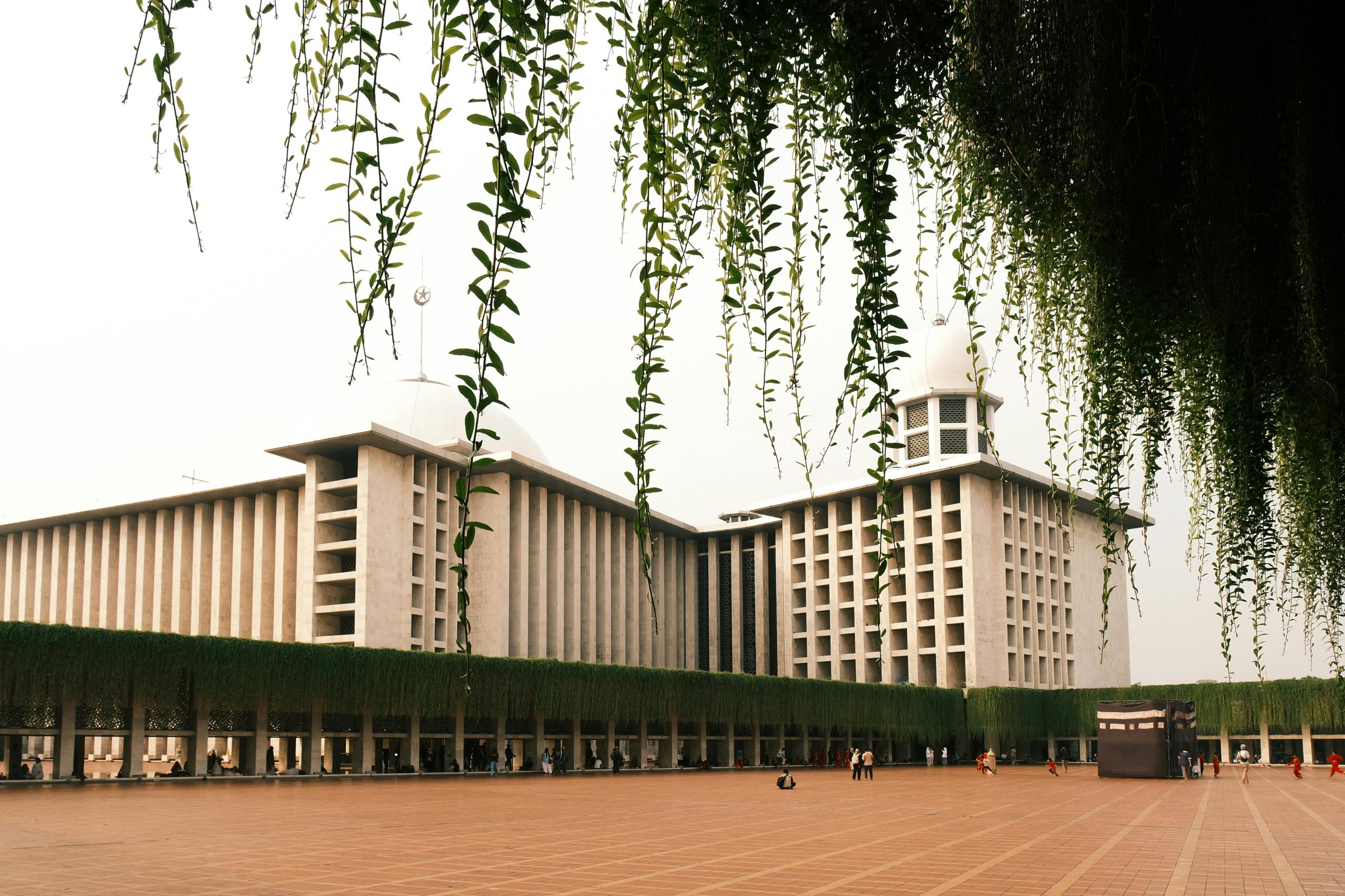Captivating view of Istiqlal Mosque with surrounding greenery in Jakarta, Indonesia.